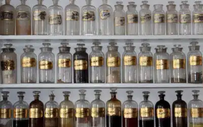 Rows of vintage apothecary jars filled with Chinese herbs used in bunion therapy