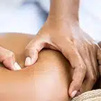 Thumb-pressure acupressure on shoulder during Doc Blackstone’s needle-free acupuncture