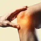 Hand channelling healing energy to painful knee during Medical Qigong treatment