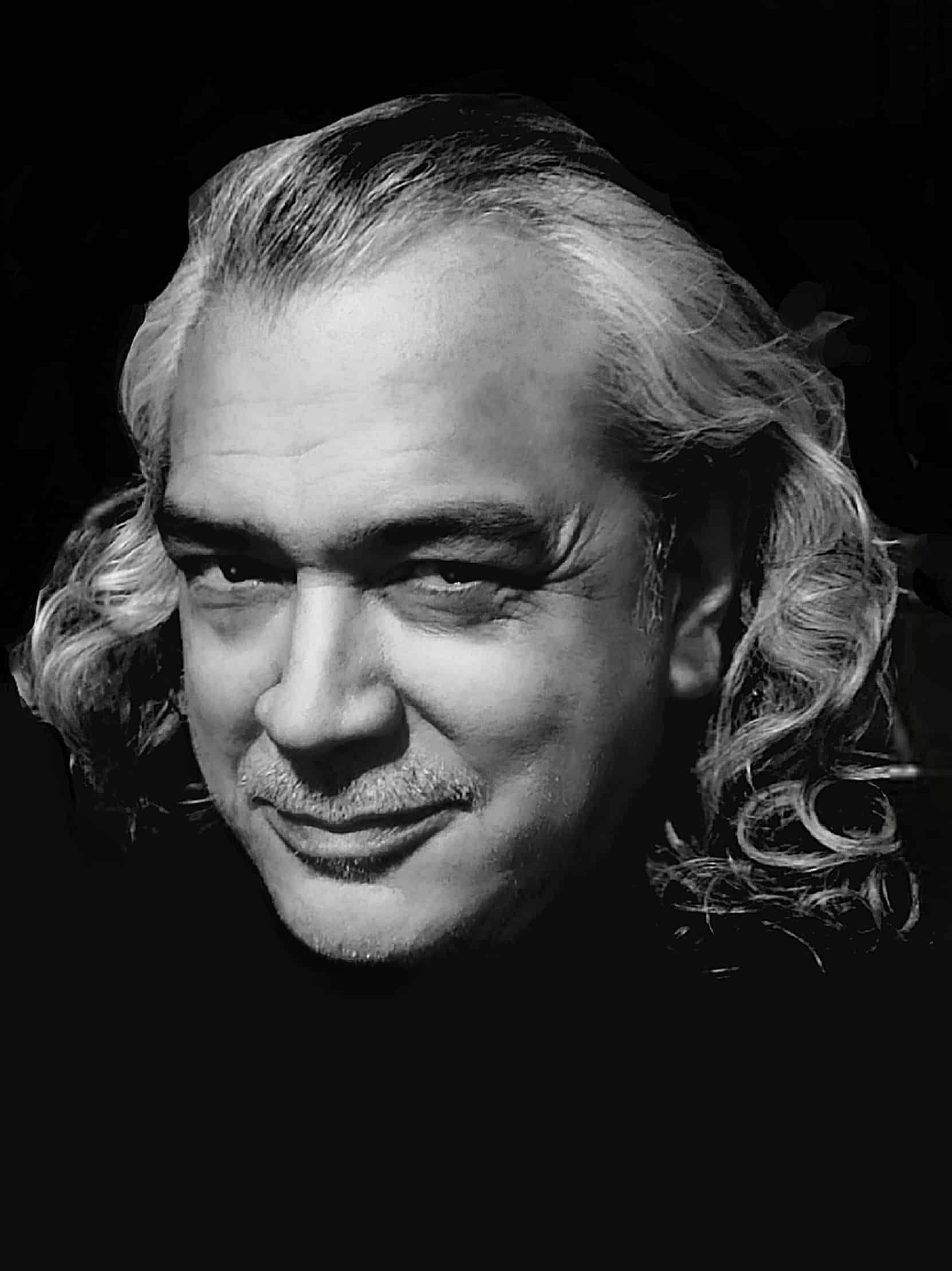 black and white portrait image of Doc Blackstone with long hair circa 2024