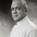 Black and white portrait of Doc Blackstone in white uniform